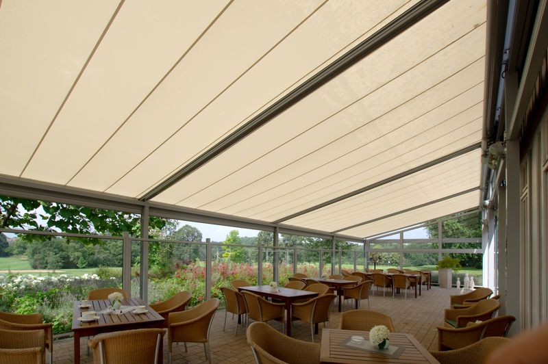 Reference image of glass awning mx 8800 with cream-colored fabric cover in Ostenfelde (photographed from below)