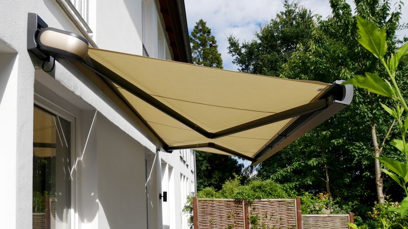 Cassette awning MX-3 with exclusive coating Selection MX and beige fabric cover.