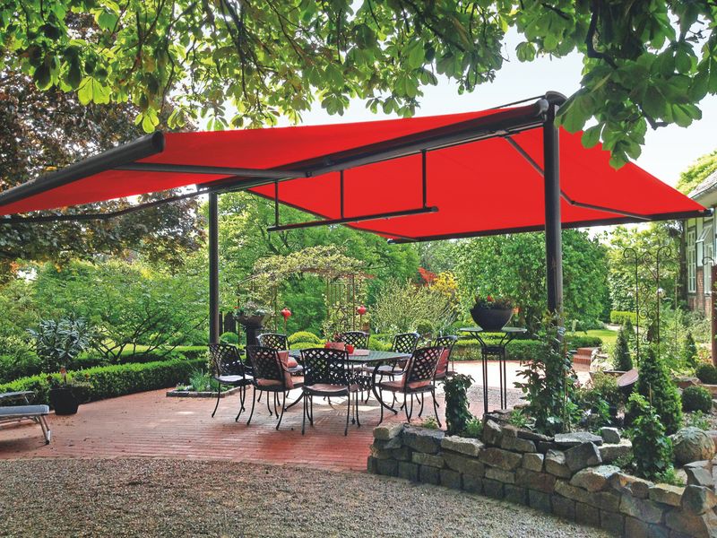 two semi-cassette awnings markilux 1600 with red fabric cover attached to a markilux syncra.
