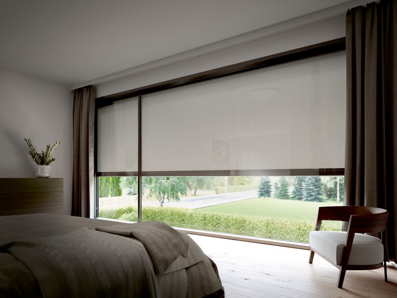 View from the bedroom to the outside. The vertical blaind awnings markilux 876 with white fabric cover are half lowered.