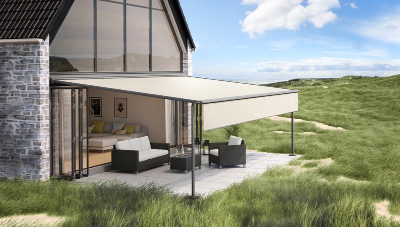 House with markilux pergola classic with beige cloth and shade plus on the beach in the dunes.