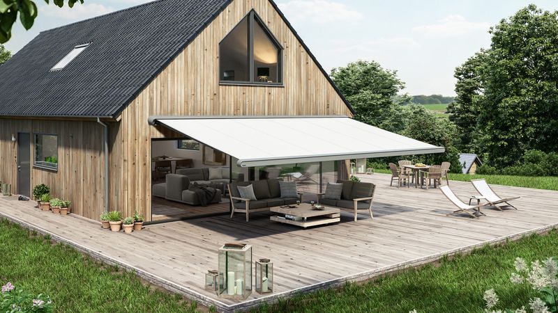 cassette awning markilux mx-1 compact (gray cassette, white fabric cover) on a wooden house