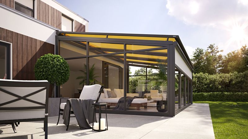 On glass awning with yellow fabric cover and dark gray frame