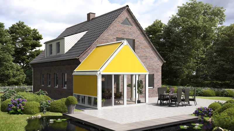View from the garden on a brick house with attached winter garden, which is adjacent to a terrace with a pond. The winter garden has awnings for shading. The gable is equipped with a yellow triangular blind markilux 893.