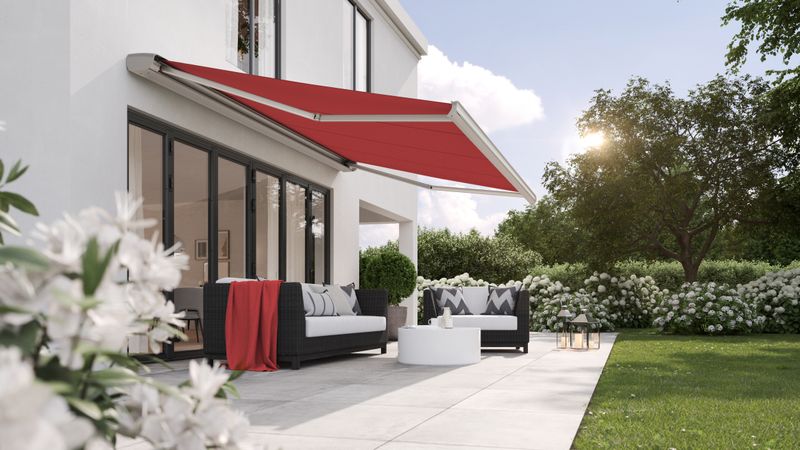 markilux MX-2 with red awning fabric on a city villa