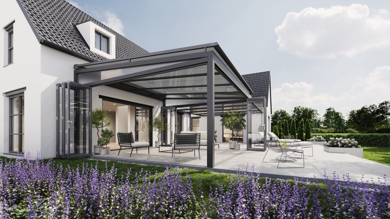On-glass awning markilux 7800 mounted above a winter garden. A large garden surrounds the terrace and in the background is a new construction house.