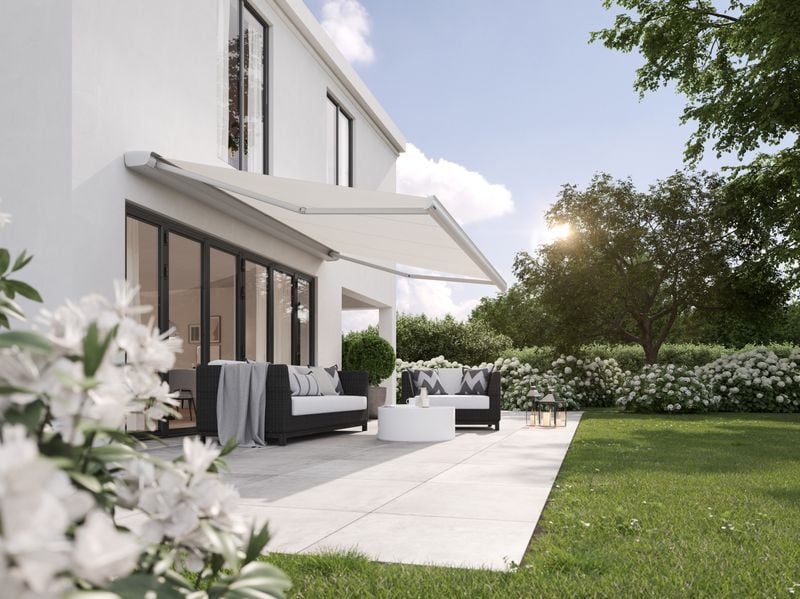 markilux mx-2 in gray with white cloth over a terrace at a white house
