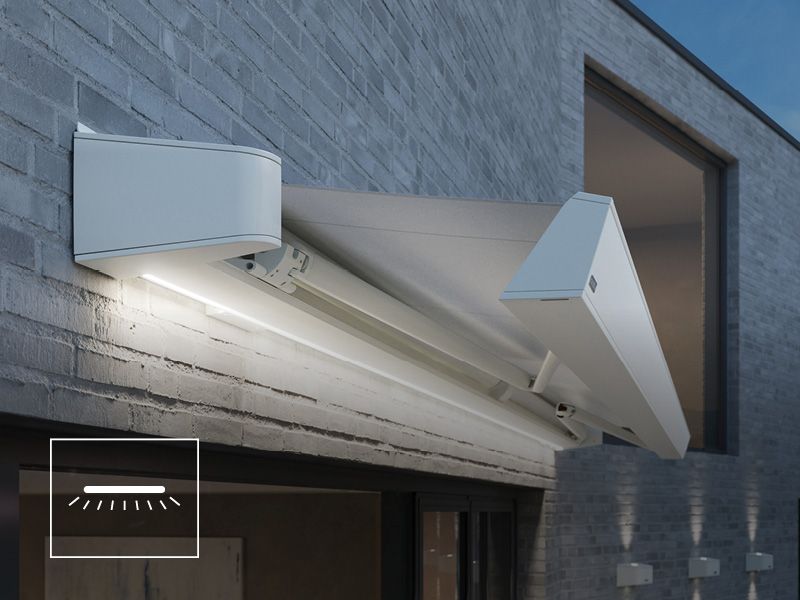 markilux MX-4 semi-open cassette awning in white with LED Line in the cassette and white fabric on gray house wall