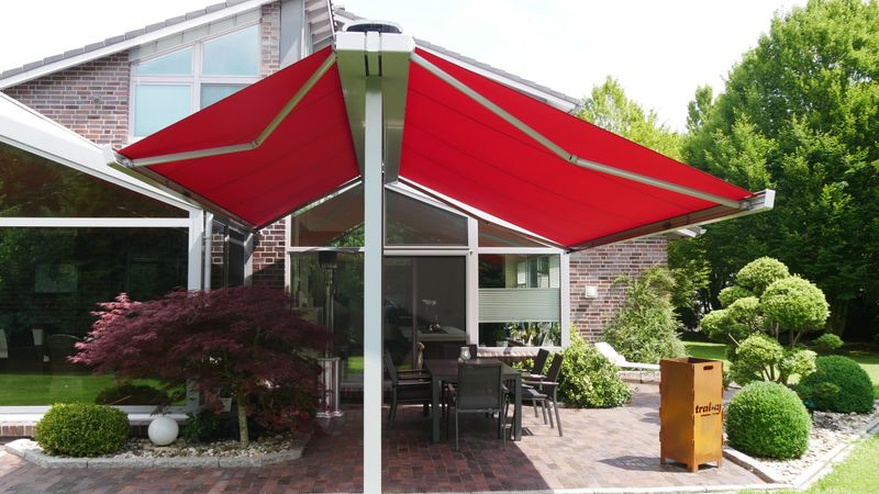 markilux syncra with cassette awning markilux 970 with red fabric cover on both sides.
