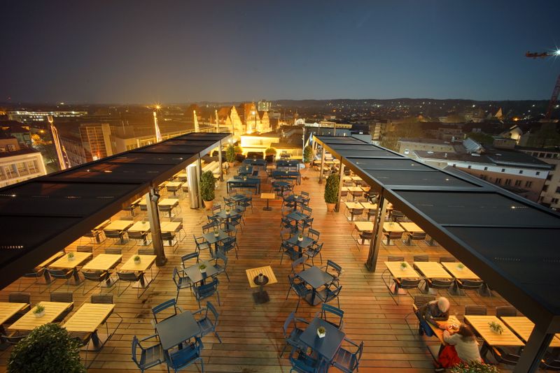 Reference image mx markant on a roof terrace at night with lighting in Bielefeld
