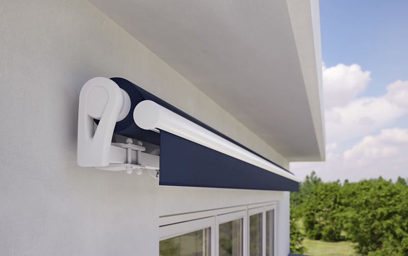 markilux 1300 in white with blue cloth on a white house wall
