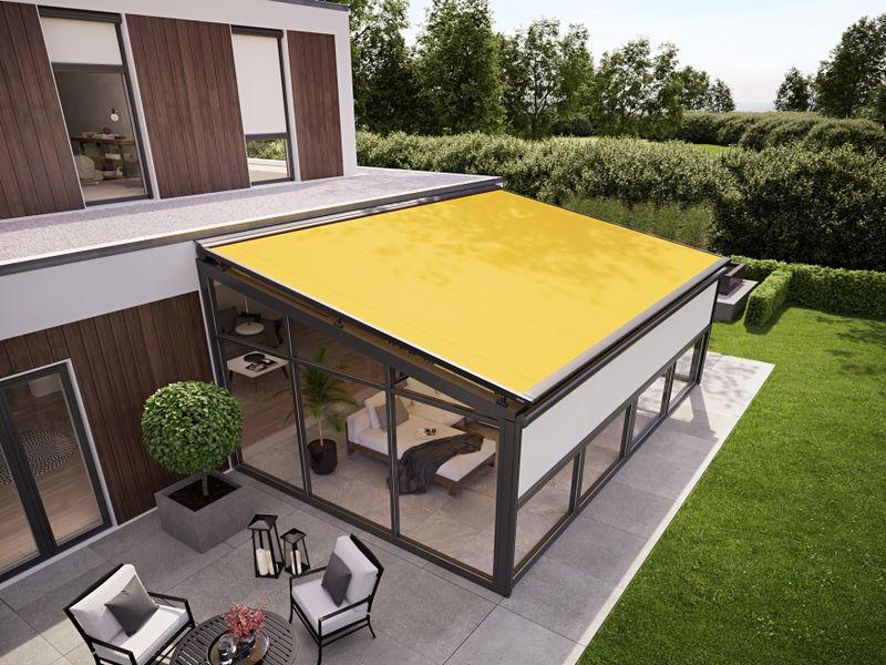 Winter garden with on glass awning with yellow fabric and vertical blind with beige fabric cover to protect low sun.