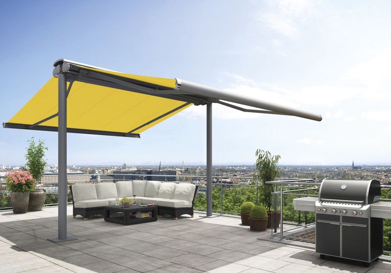 Free-standing awning system markilux syncra with two awnings with yellow fabric cover on a roof terrace.